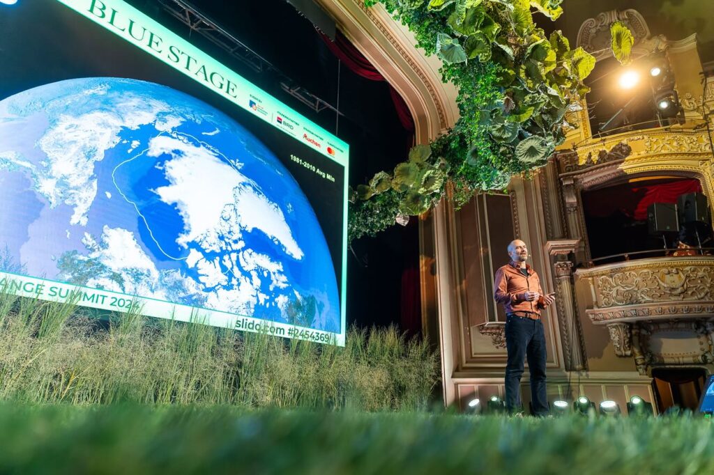 Tom Meijeraan, co-founder and COO of Arctic Reflections, speaking on stage at the Climate Change Summit 2024